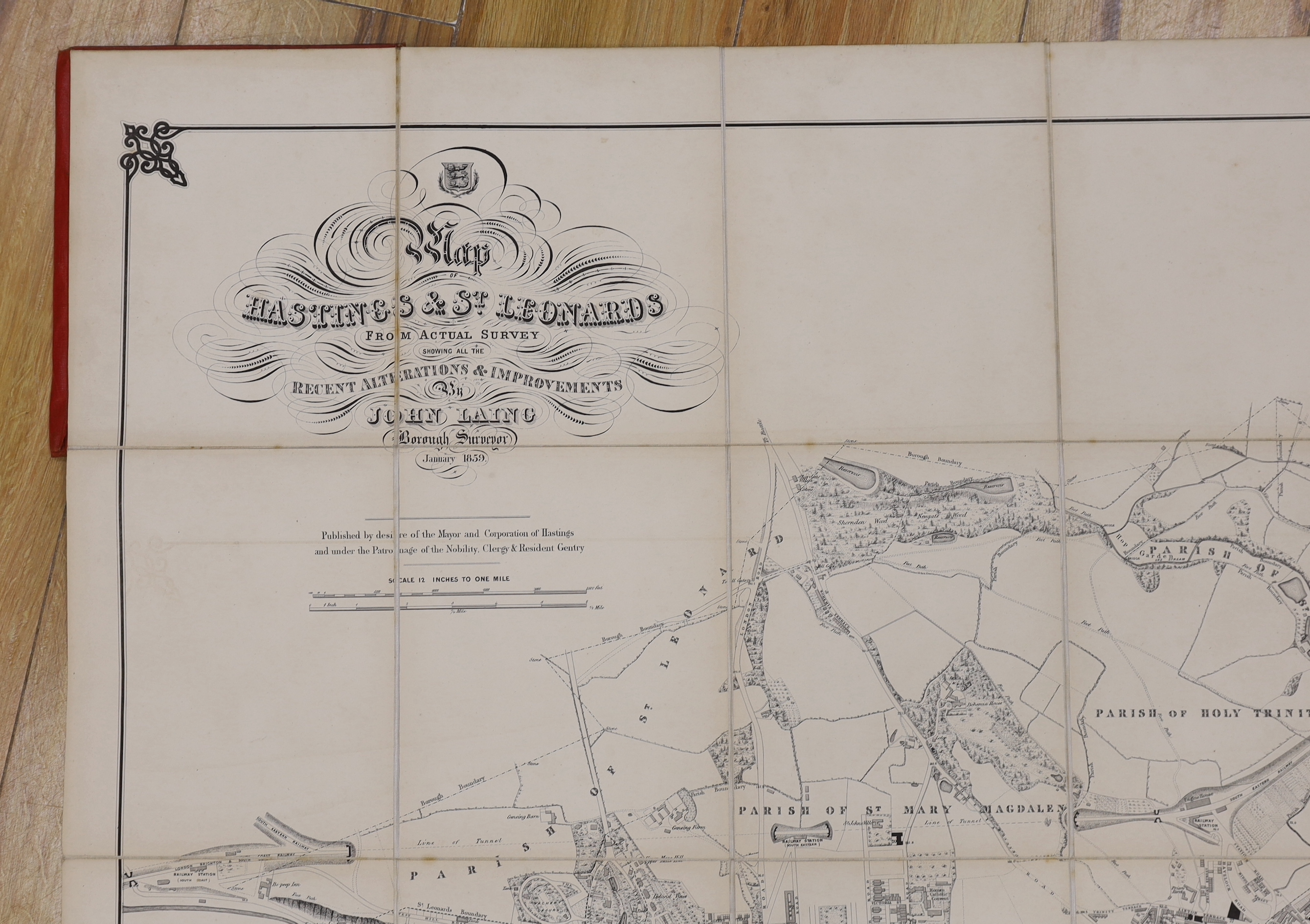 HASTINGS - Laing, John (Borough Surveyor) - Map of Hastings and St. Leonards, on linen in red cloth binding with gilt lettering, scale: 12 inches to 1 mile, Hastings, January 1859, 68.5 x 131cms